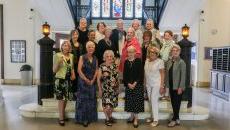 Reunion class gathered on the marble stairs